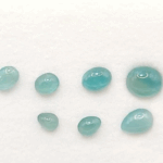 Blue Grandidierite Set with 9 natural stones totaling 19 carats in oval and pear cuts