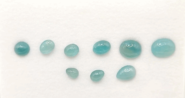 Blue Grandidierite Set with 9 natural stones totaling 19 carats in oval and pear cuts