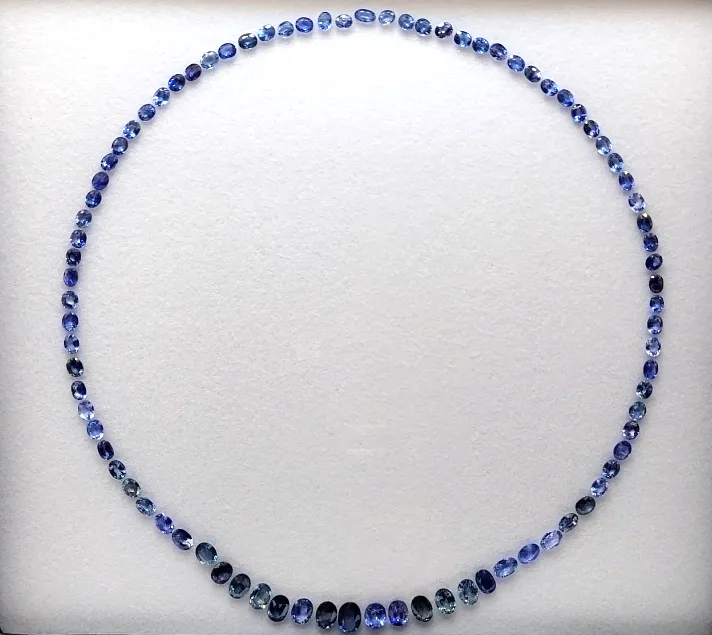 SA3PUGGB Cornflower blue sapphire necklace set, 40 CT of graduated natural sapphires laid out for a bespoke jewelry design
