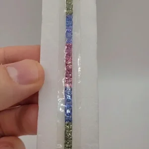 Natural rainbow sapphire suite of 51 calibrated 3.5mm stones arranged as a bracelet set, 14.5 ct total
